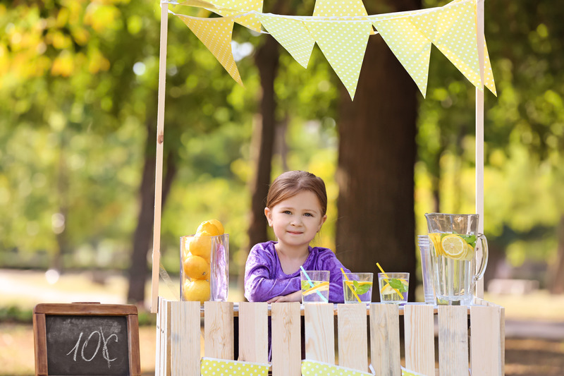 child with lemonade stand